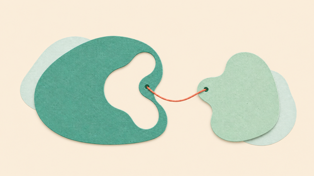 Large and small organic green forms connected by a thin coral thread.